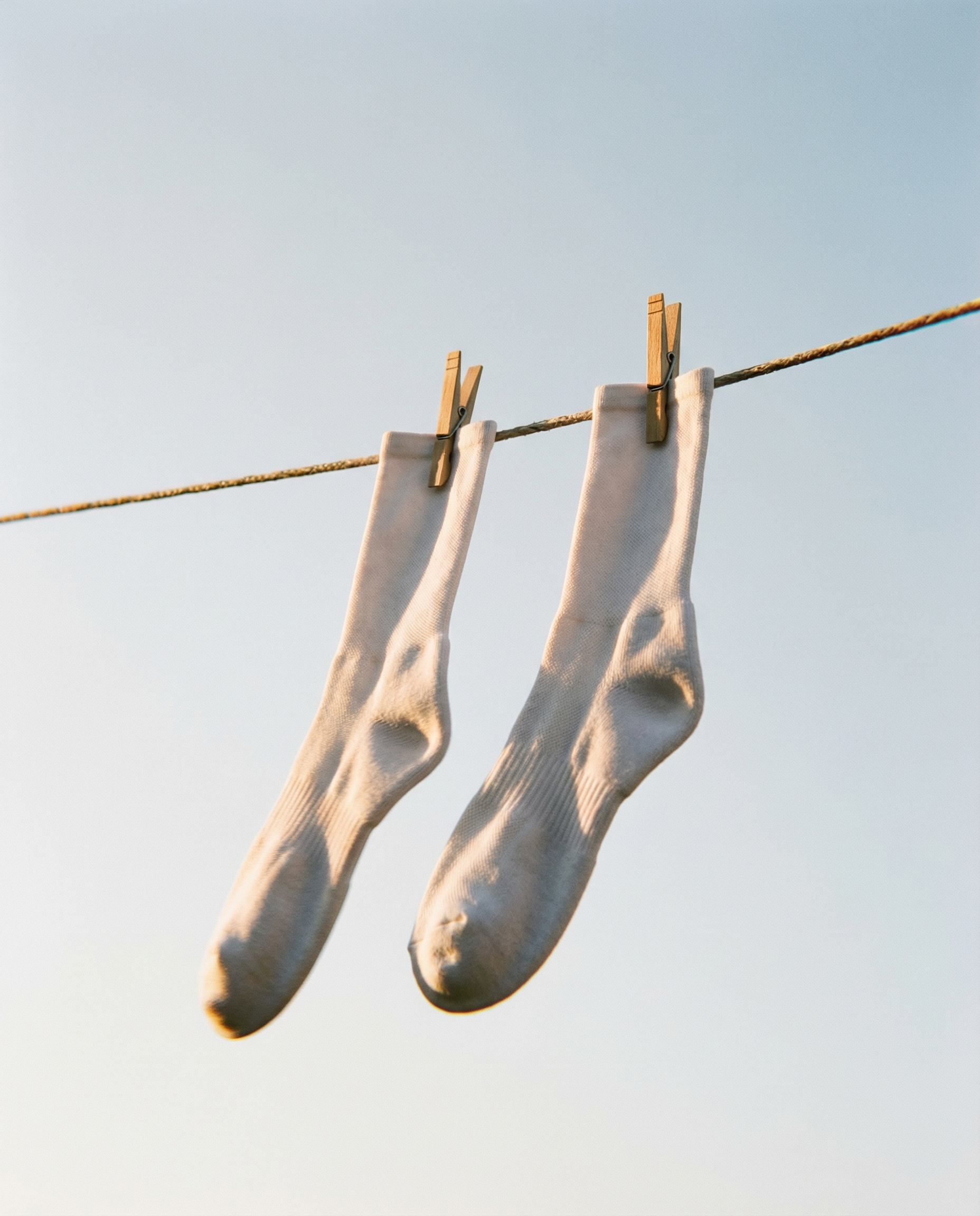 Hvide løbestrømper som signaturprodukt